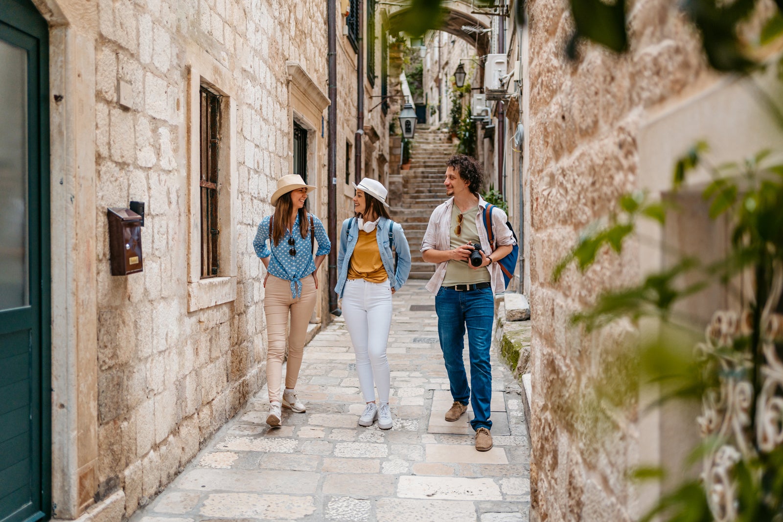 Three Young Friends Walking In An Alley In Dubrovnik